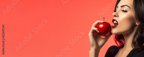 Beautiful young woman holding a red apple - symbolic of sin and temptation banner