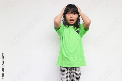 Surprised happy beautiful girl looking at camera in excitement, isolated on white background
