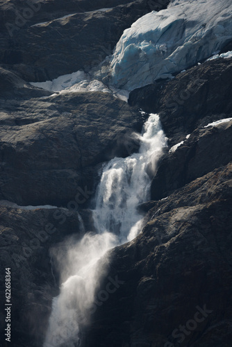 Fototapeta Naklejka Na Ścianę i Meble -  a sign of climate change. waterfall of meltwater at Triftgletscher, Berner Oberland