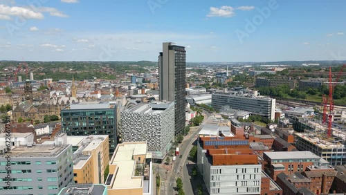 Aerial drone video of the city centre in Sheffield England with many office buildings