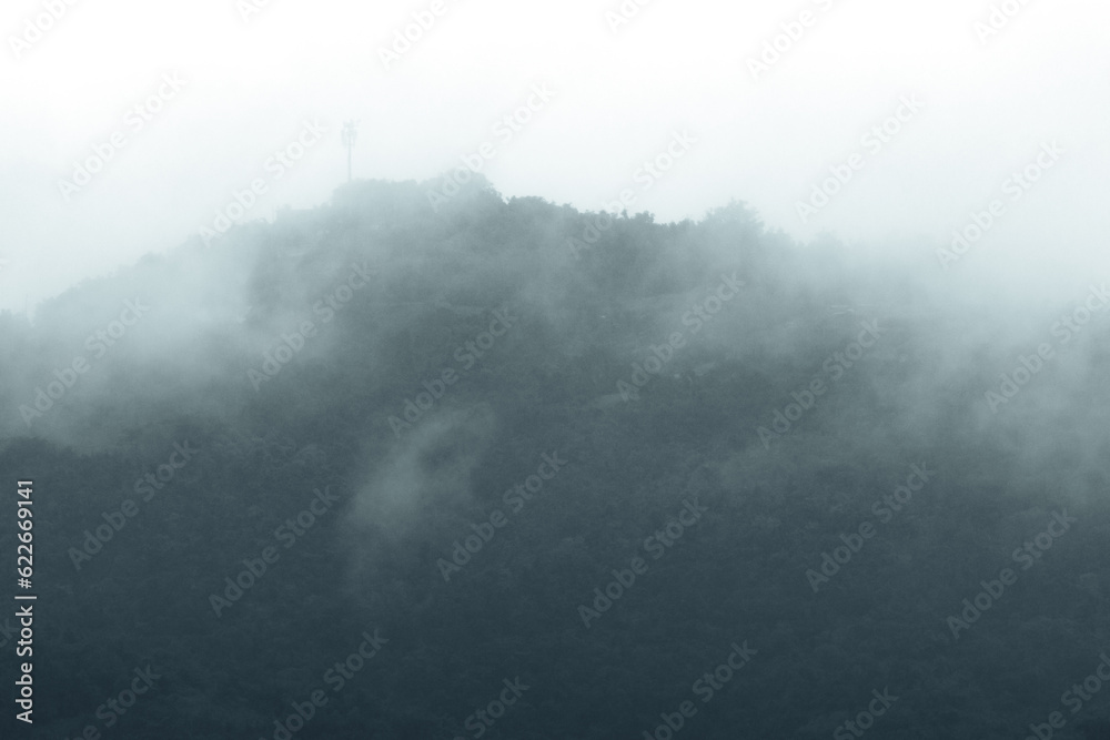 Obraz premium Top of a foggy mountain scene on rainy day from puerto rico 