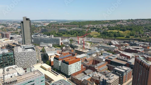 Aerial drone video of the city centre in Sheffield England with many office buildings