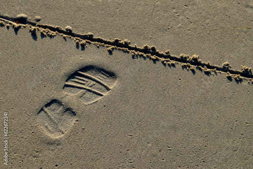 Fotografia Crossing a line in the sand
