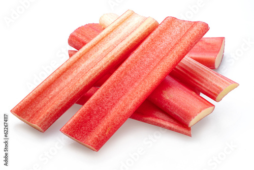 Red rhubarb stems' cuts isolated on white background.