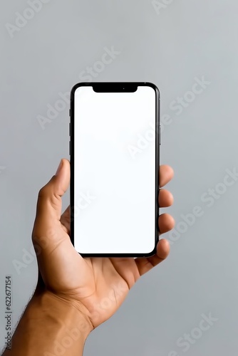 Phone in hand with a white screen on a gray background