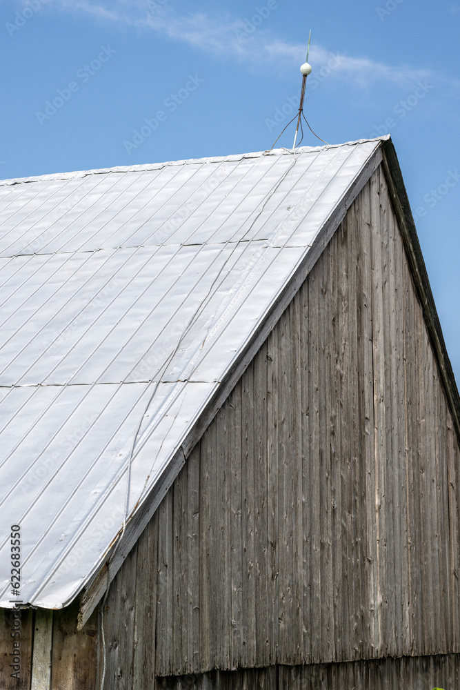 A lightning conductor on an old barn A lightning conductor on an old barn
