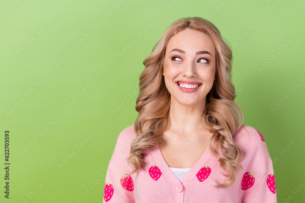 Portrait of adorable lady stylish curls look wondered empty space wear pink shirt cardigan isolated green color background Portrait of adorable lady stylish curls look wondered empty space wear pink shirt cardigan isolated green color background