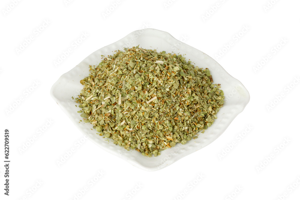 White plate with oregano spices. Isolate on a white background.