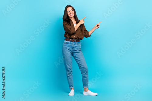 Full length photo of young girl direct finger look empty copy space mock up wear casual trendy outfit isolated blue color background