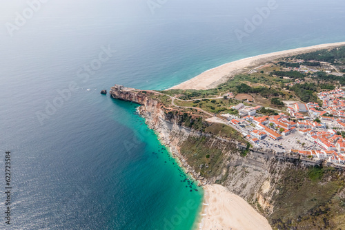 Aerial view of Forte de Sao Miguel Arcanjo, a lighthouse on the cliff point in Nazaré, Leiria district, Portugal. photo