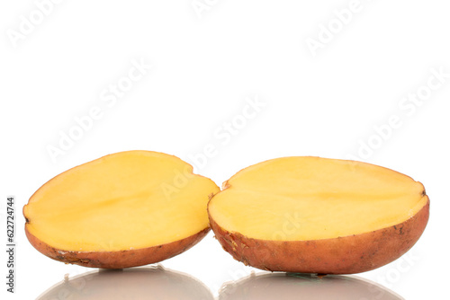 Two halves of a pink, raw potato, macro, isolated on a white background.