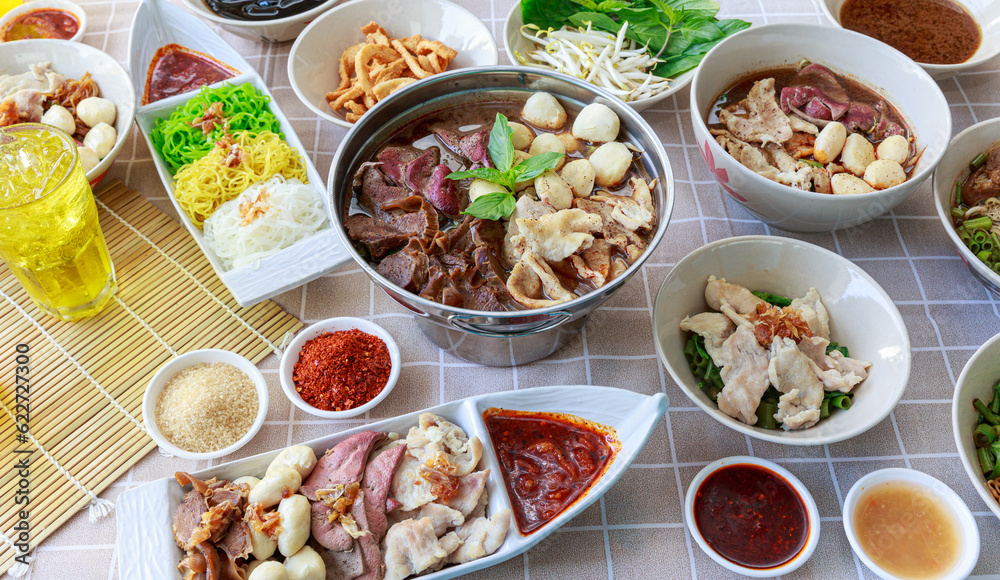 Thai boat noodles with Thai spices and ingredient on background.