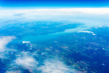 View to a land and clouds from airplane