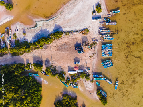 Aerial view of the resting area of fishermen with fishing boats docked along the shore at Chelem, Yucatan, Mexico. photo