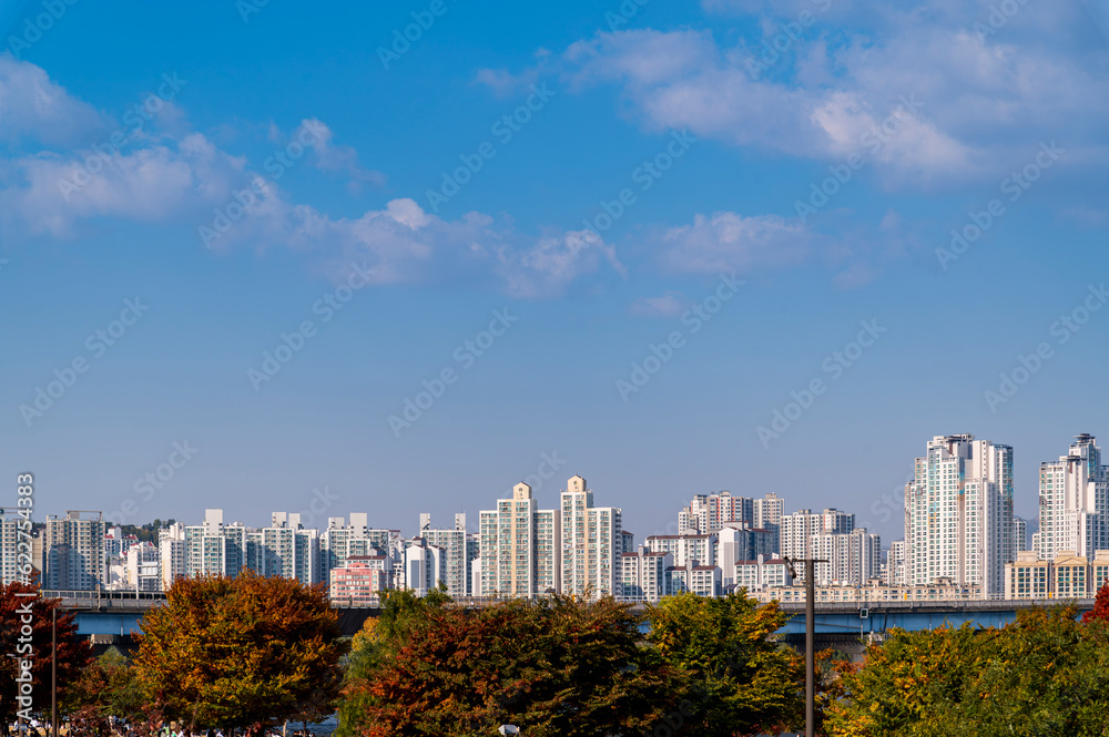 Seoul cityscapes, skyline, high rise office buildings and skyscrapers with blue sky and cloud in Seoul city, South Korea