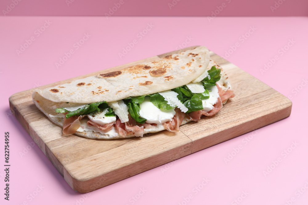 Italian cuisine , Piadina with Italian ham and cheese Italian cuisine , Piadina with Italian ham and cheese