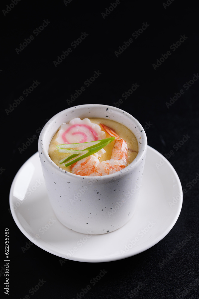 Japanese Traditional food Eggs Custard Chawanmushi isolated in black background Japanese Traditional food Eggs Custard Chawanmushi isolated in black background