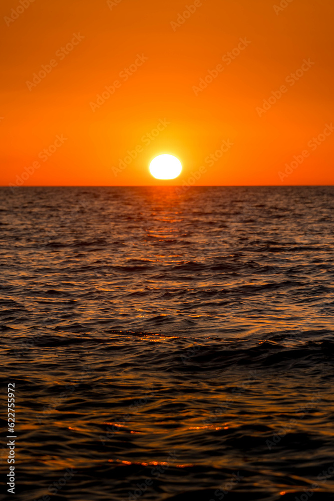 The scenic sunrise over the Caspian sea at the Mahachkala shore in the Dagestan Republic, southern Russia