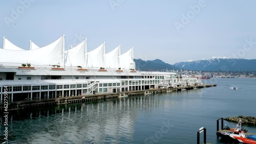 Canada Place and commercial buildings in Downtown Vancouver Viewed from water during Blue Sky Day. British Columbia, Canada. Urban Modern City Landmark photo