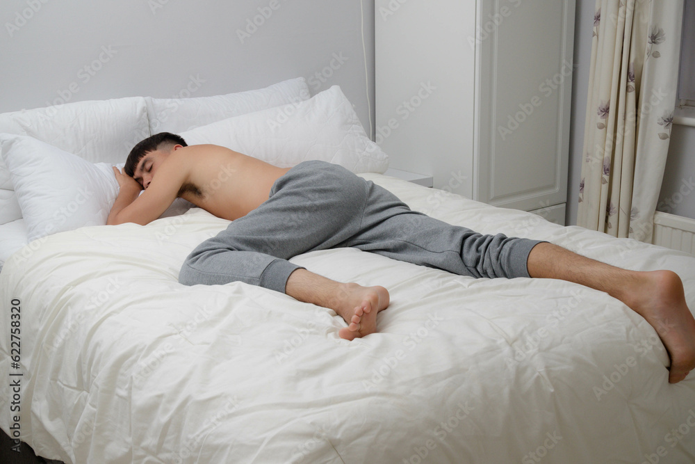 Shirltess Young Man Sleeping On Bed Shirltess Young Man Sleeping On Bed
