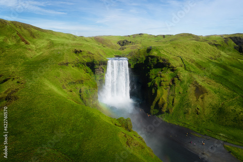 Aerial top view of Skogafoss waterfall in summer season. Famous nature landscape background