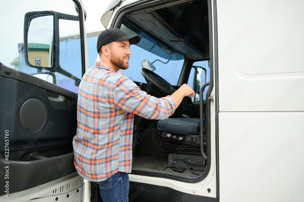 Back view of driver getting into truck cabin. Back view of driver getting into truck cabin.