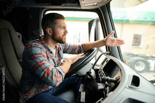driver behind the wheel in truck cabin
