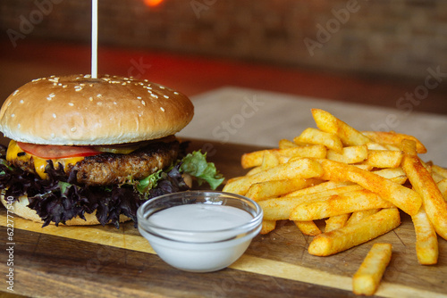 delicious juicy burger and fries