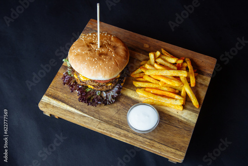 delicious juicy burger and fries