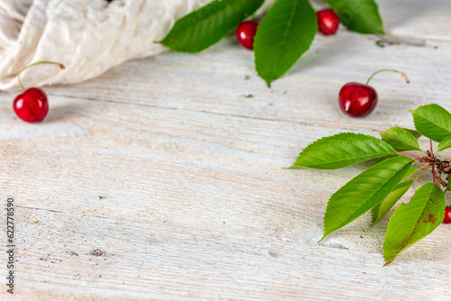 Elegant Simplicity: White Plank with Cherries and Cherry Tree Blooms