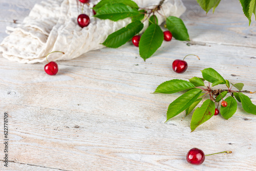 Rustic Serenity: Wooden White Background with Cherries and Cherry Blossoms