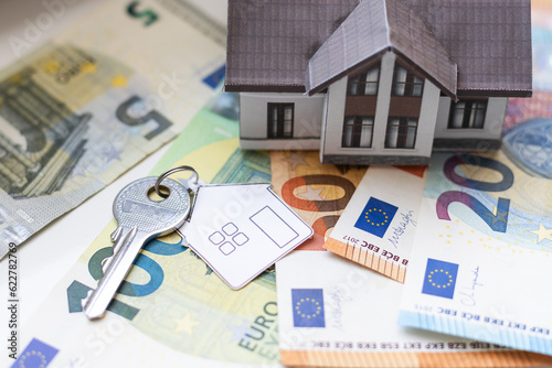 Bild auf Leinwand Building money and costs that arise when building a house