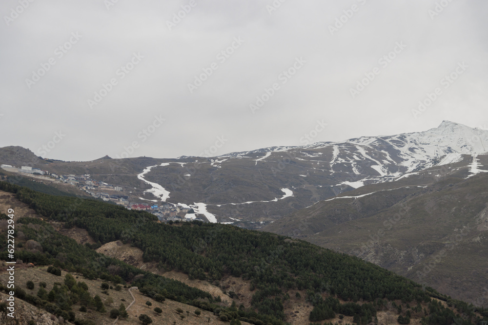 Mountain landscape with ski slopes and snow in Sierra Nevada, Granada, Spain.
