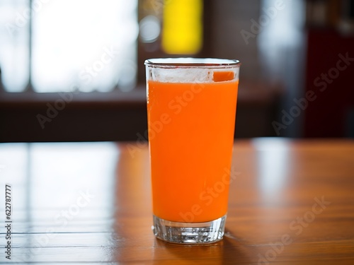 Fresh orange juice in the glass - Fresh juice on the table