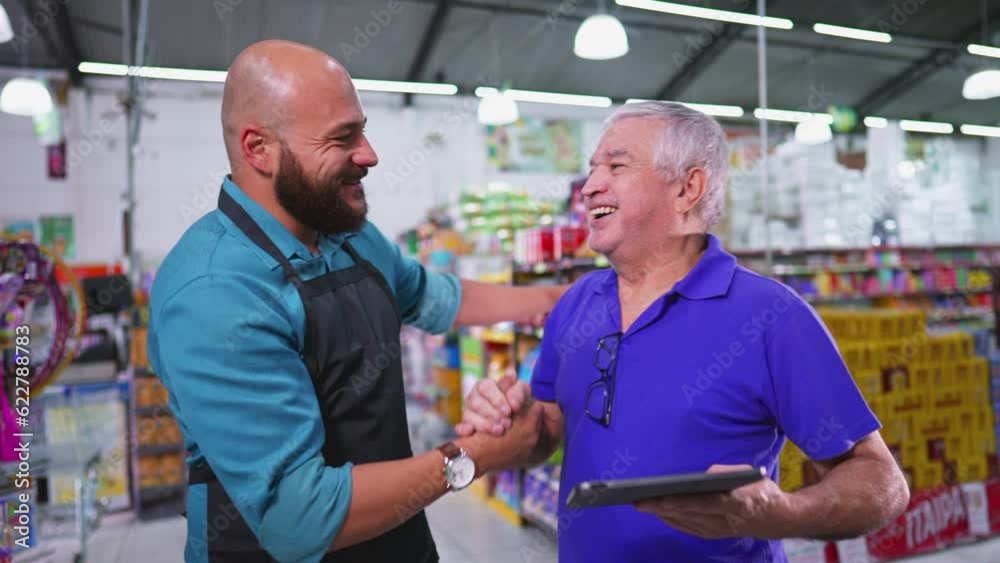 Grocery Store Boss Congratulating Employee for Good Job. High-Five Celebration for Supermarket Staff Achievement, senior manager posing for camera with male staff