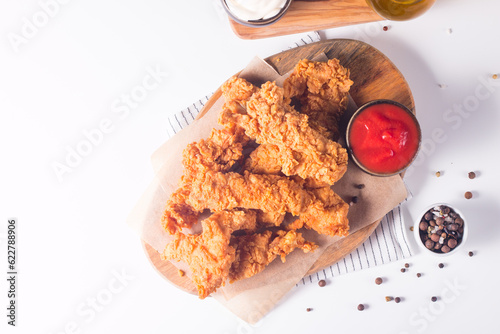 Принти на полотні Crispy fried chicken breast strips with sauce