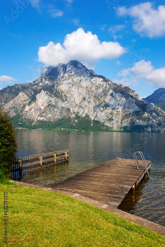 Panoramic view of Traunstein at Traunsee lake during sunset, landscape photo of lake and mountains near Gmunden, Austria, Europe