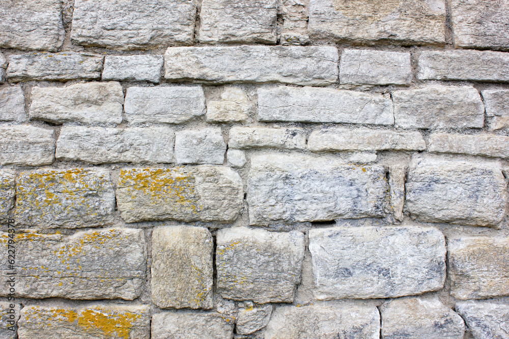 Old stonework. Ancient masonry blocks. Ancient stone wall.Old masonry from stone blocks. Ancient cobblestones stacked in a wall.