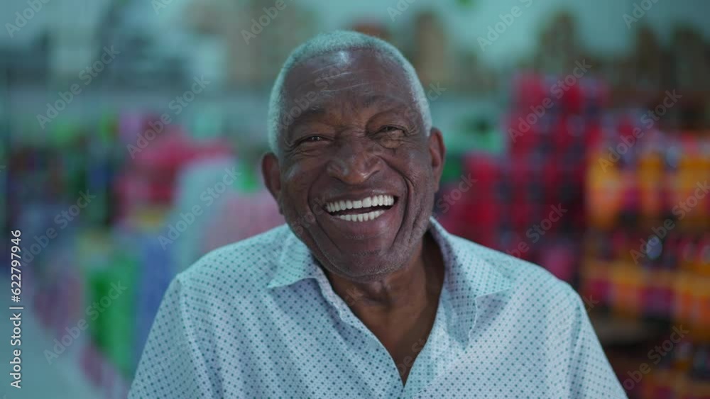 One joyful black senior man smiling and laughing portrait close-up face face with gray hair and friendly expression One joyful black senior man smiling and laughing portrait close-up face face with gray hair and friendly expression