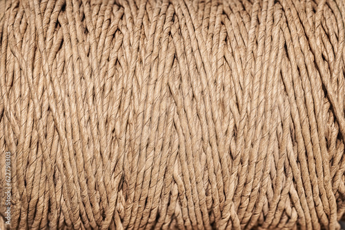 A skein of paper brown twine, background.