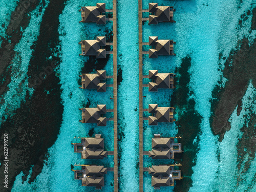 Aerial view of overwater bungalows at Himmafushi Atoll, Maldives. photo