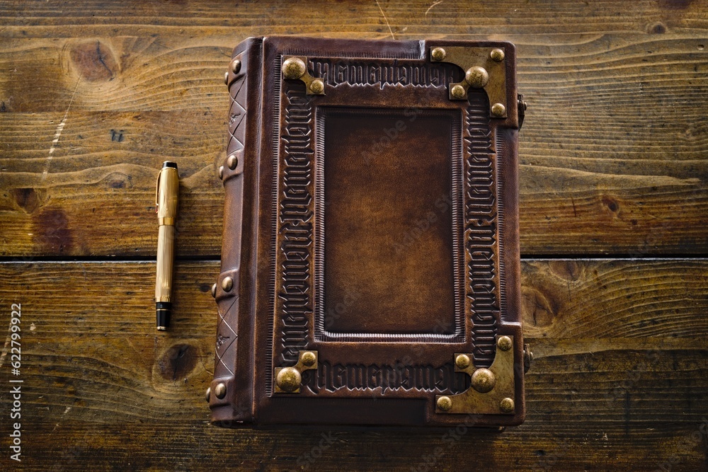 Aged leather book cover, design with embossed ambigram Aged leather book cover, design with embossed ambigram