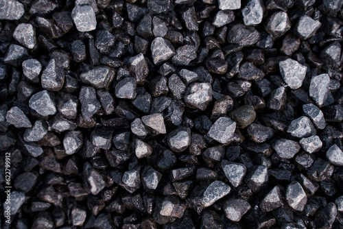 Small black pebbles close-up, background image
