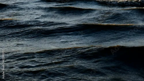 a stormy wind makes waves on the sea 4K