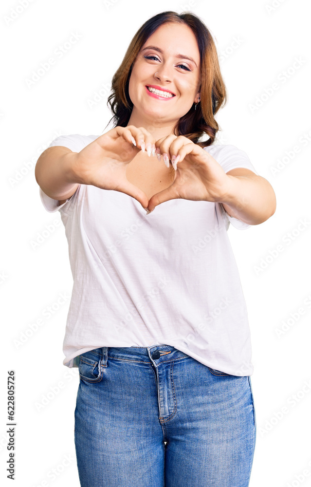 Young beautiful caucasian woman wearing casual white tshirt smiling in love doing heart symbol shape with hands. romantic concept. Young beautiful caucasian woman wearing casual white tshirt smiling in love doing heart symbol shape with hands. romantic concept.