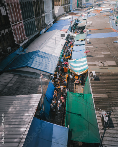 Aerial view of people on the railway at Rom Hup train market in Bangkok, Thailand. photo