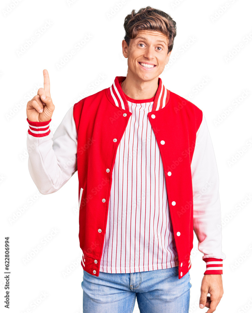Young handsome man wearing baseball uniform showing and pointing up with finger number one while smiling confident and happy. Young handsome man wearing baseball uniform showing and pointing up with finger number one while smiling confident and happy.