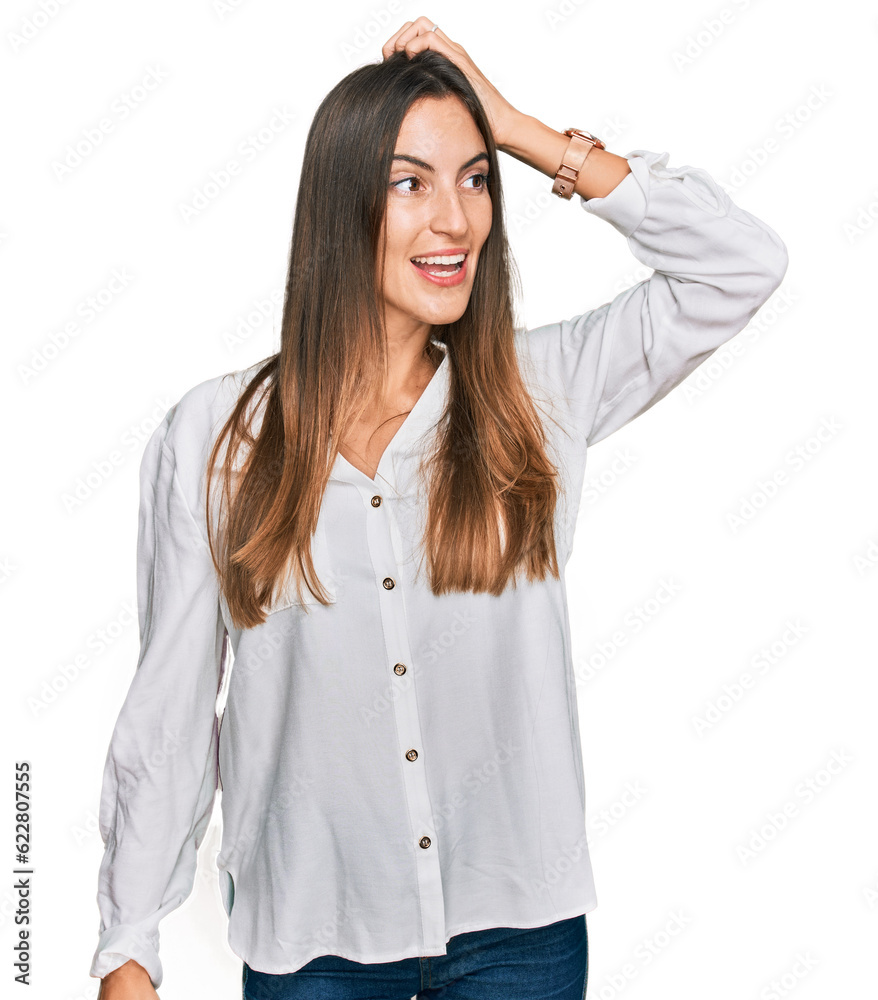 Young beautiful woman wearing casual clothes smiling confident touching hair with hand up gesture, posing attractive and fashionable Young beautiful woman wearing casual clothes smiling confident touching hair with hand up gesture, posing attractive and fashionable