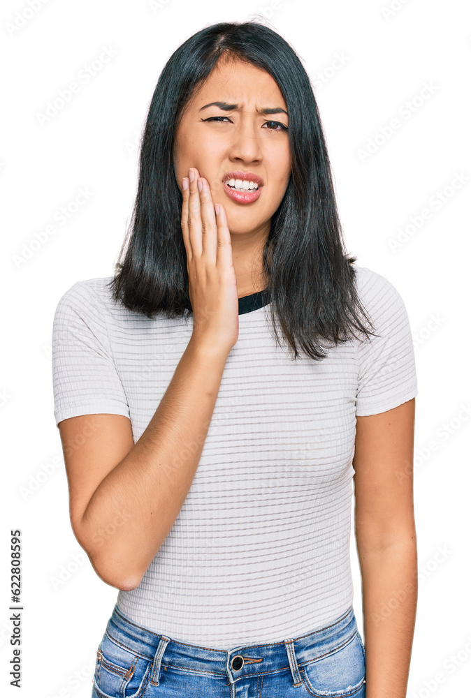 Beautiful asian young woman wearing casual white t shirt touching mouth with hand with painful expression because of toothache or dental illness on teeth. dentist Beautiful asian young woman wearing casual white t shirt touching mouth with hand with painful expression because of toothache or dental illness on teeth. dentist