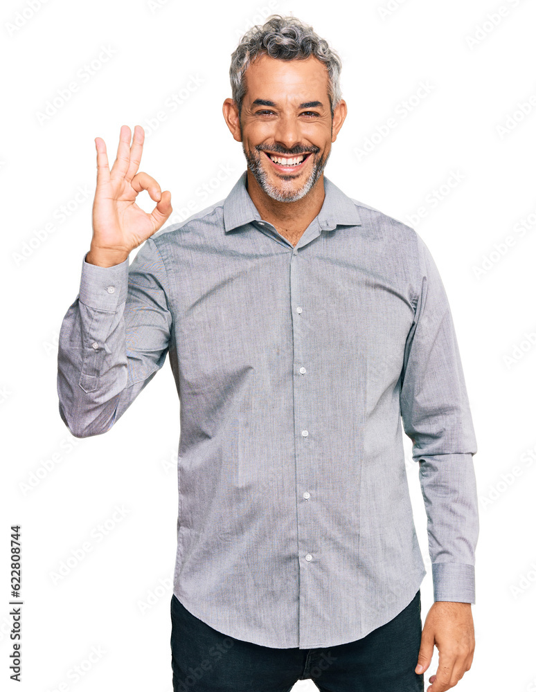 Middle age grey-haired man wearing casual clothes smiling positive doing ok sign with hand and fingers. successful expression. Middle age grey-haired man wearing casual clothes smiling positive doing ok sign with hand and fingers. successful expression.